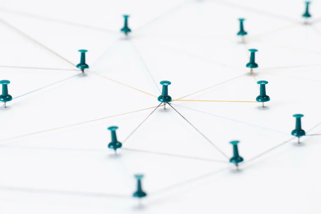 Network diagram concept using pins and threads to illustrate connectivity