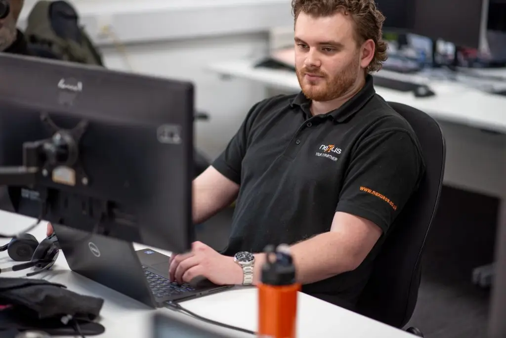 A Nexus IT engineer works on a support ticket