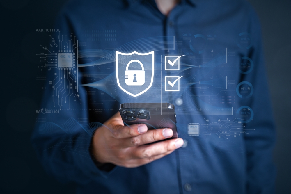 Man holding phone with MFA one time password overlay