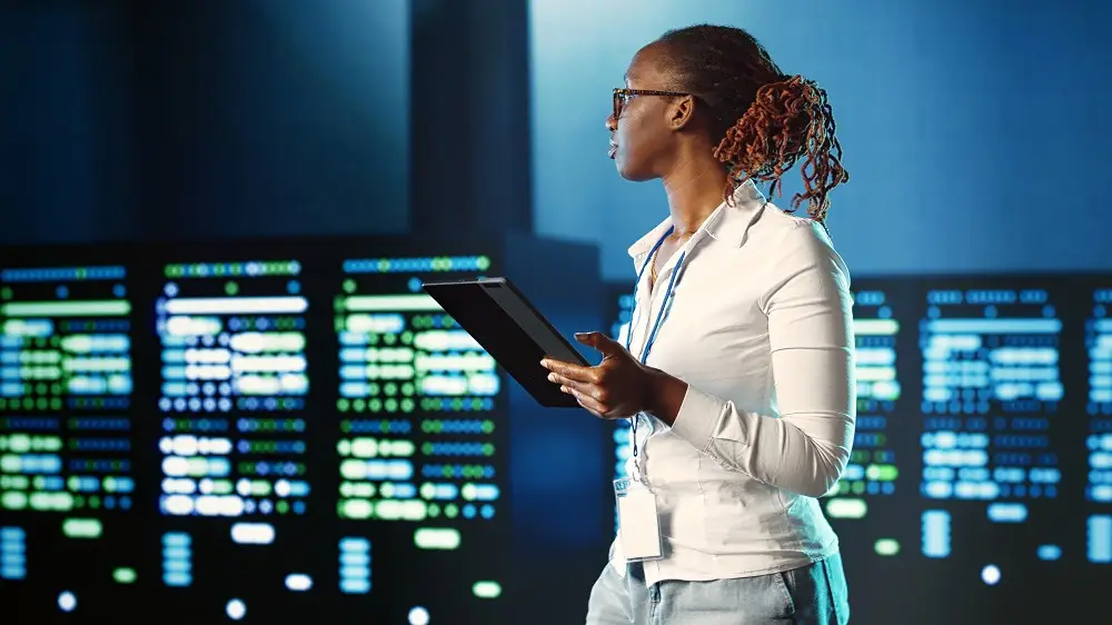woman monitoring supercomputers tasked with solving complex operations